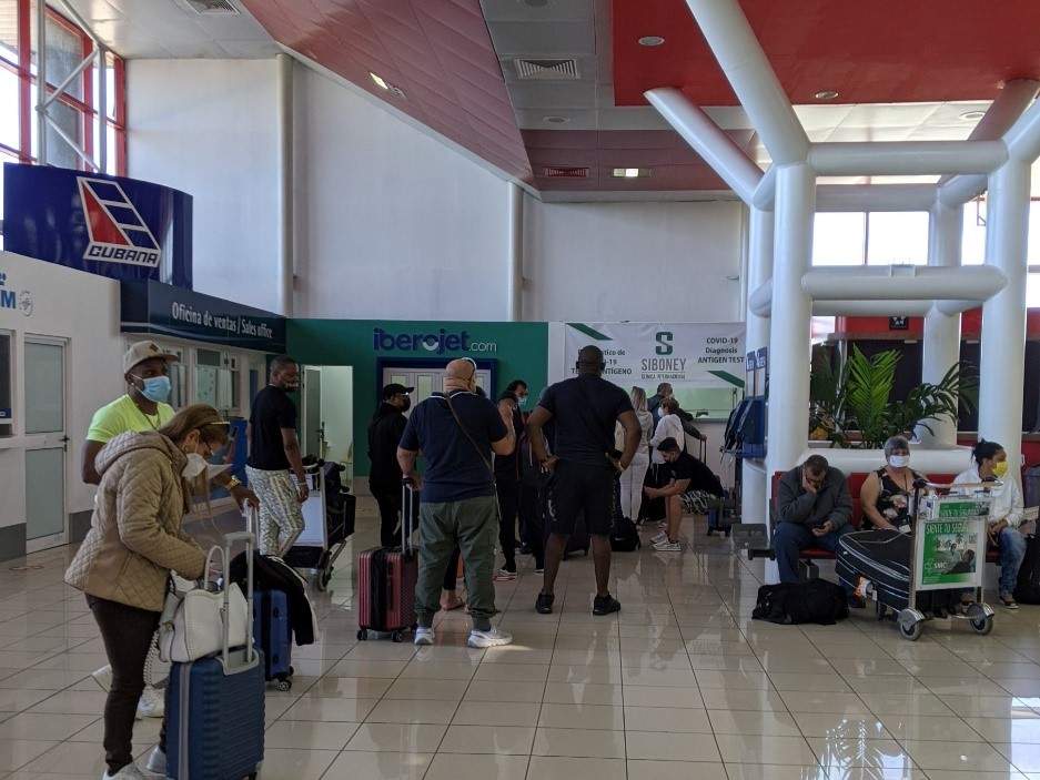 Travelers wait in line for a rapid test in Terminal 3 Jose Marti Airport